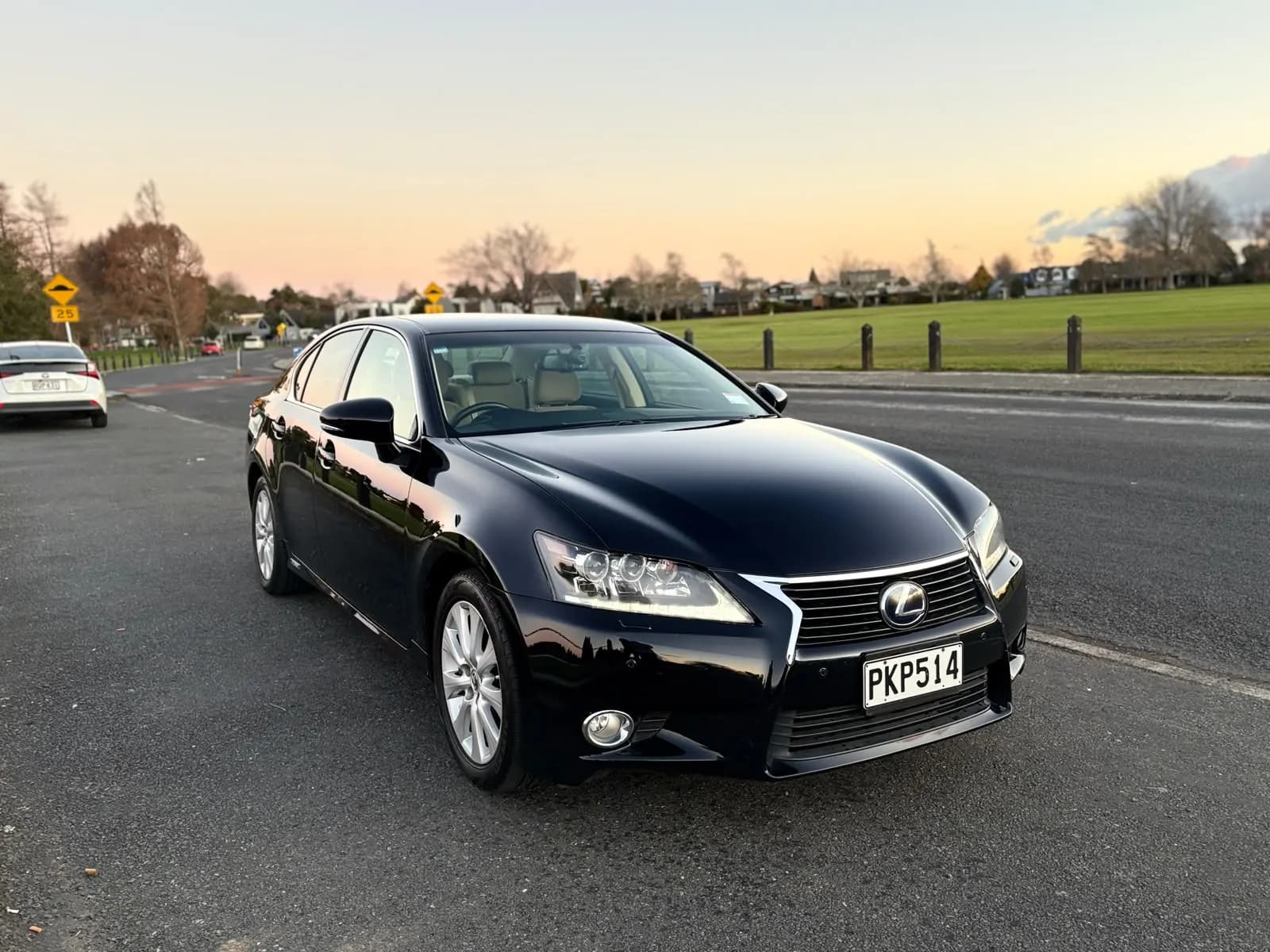 Black 2012 Lexus GS450h, front three-quarter view
