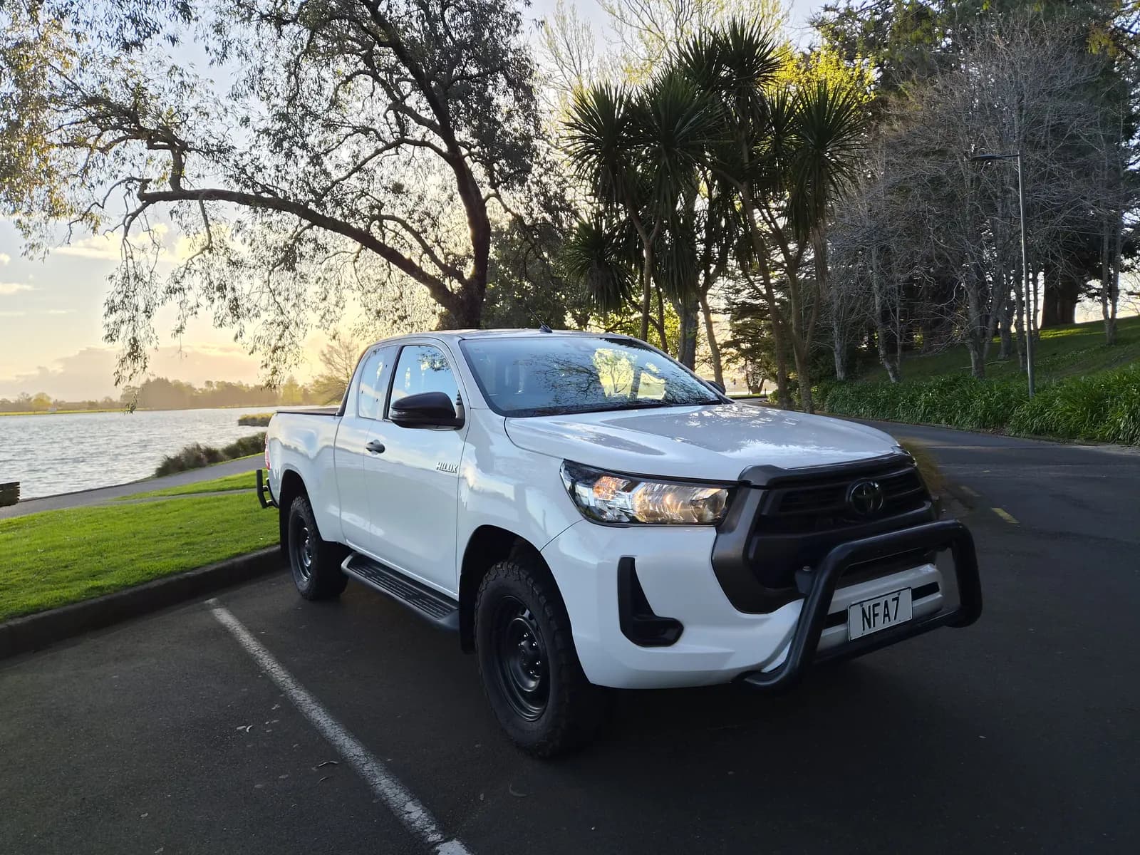 White 2020 Toyota Hilux, front three-quarter view